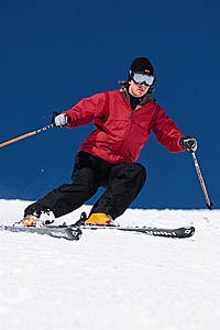 Private Lessons Start by standing on a groomer with your feet slightly wider than shoulder-width apart. Pressure the downhill ski and point your downhill kneecap…
