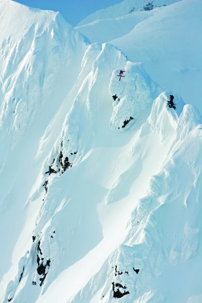 Sebastian Garhammer at Haines, Alaska, by Oskar Enander. “Weather had been bad all day. Five minutes earlier, I couldn’t even see Seb on the ridge, so when it popped blue he went within a few seconds.” …