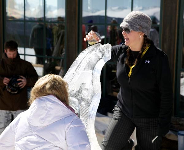 Ice Luge at Vail A skier takes a shot of Limoncello from an ice luge at the top of Vail's Blue Sky Basin.