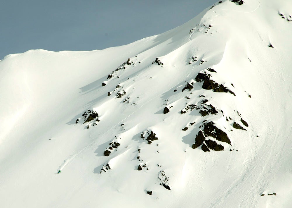 Valdez, AK Here's Paul Kimbrough, a Mount Baker, Washington-based telemark skier, watching his sluff off Thompson Pass. Kimbrough has been throwing 360s and…