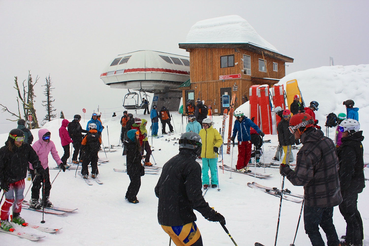 Gather Round Moments before the race, athletes huddled around the top of the chair for a final brief on conditions and course changes. Skiers then went out in a…
