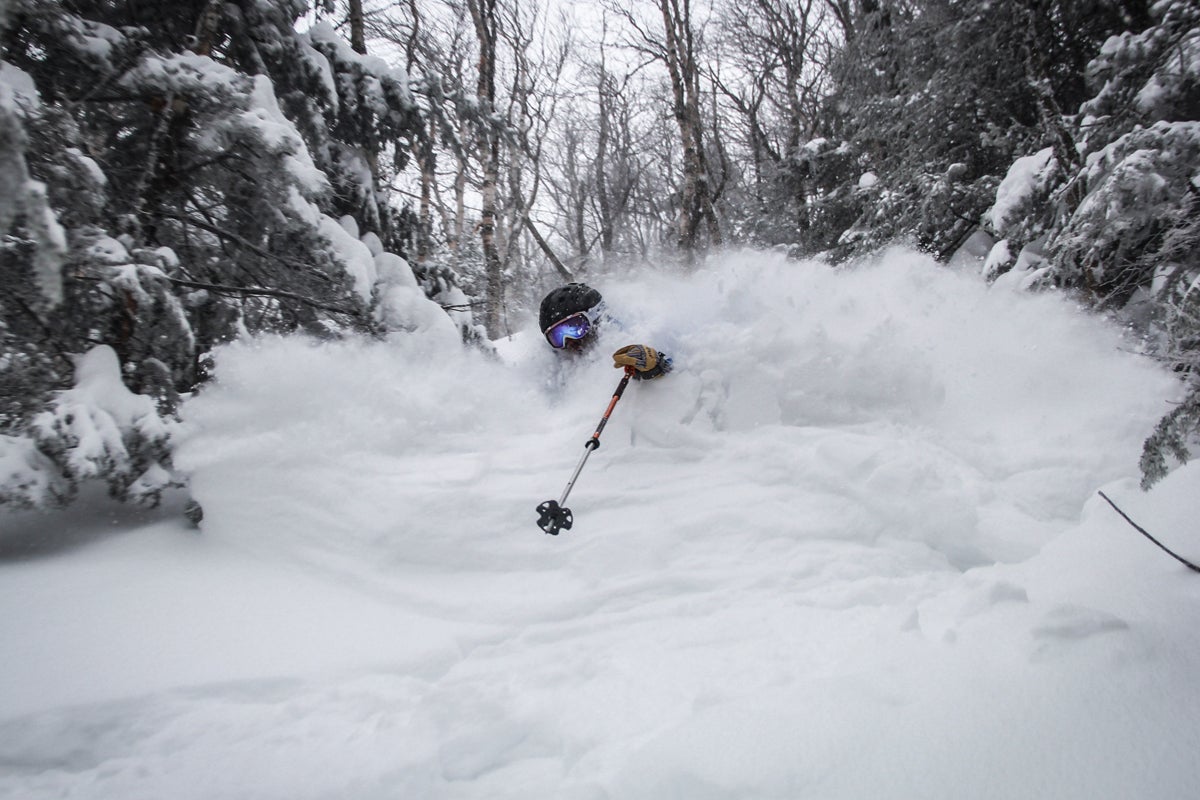 Jay Peak Skier Duane Wheeler’s tracks start where others stop. Here, he hammered through a fresh February line, choking on some flakes along the way.