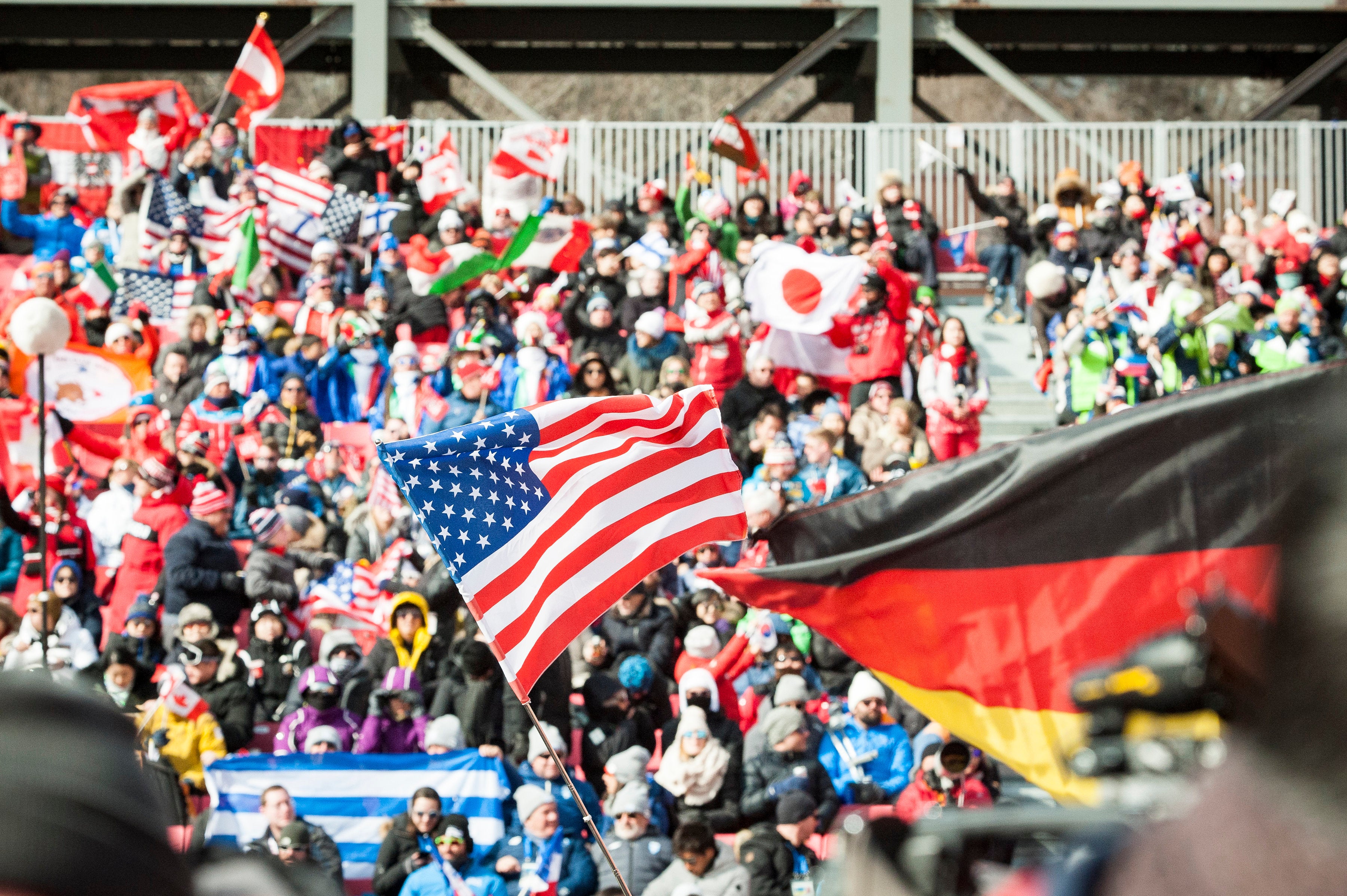usa-flag_mens-GS_crystal-sagan Flags flying in the Grand Stand at YongPyong.