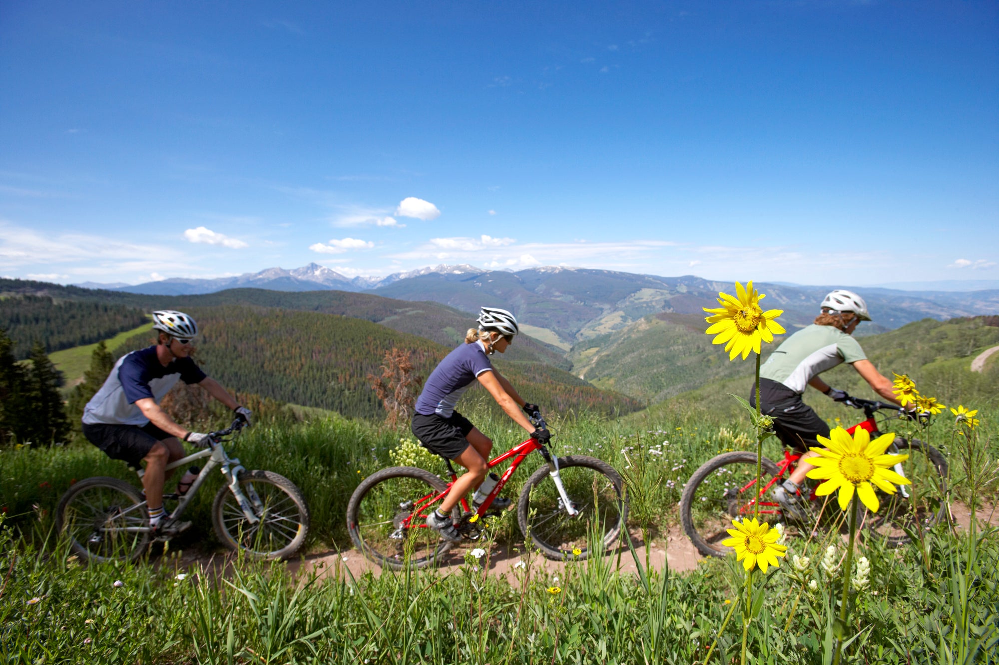 Mountain_Biking_Group_View_by_Chris_McLennan Guests participate in a mountain bike clinic at Vail Epic Discovery
