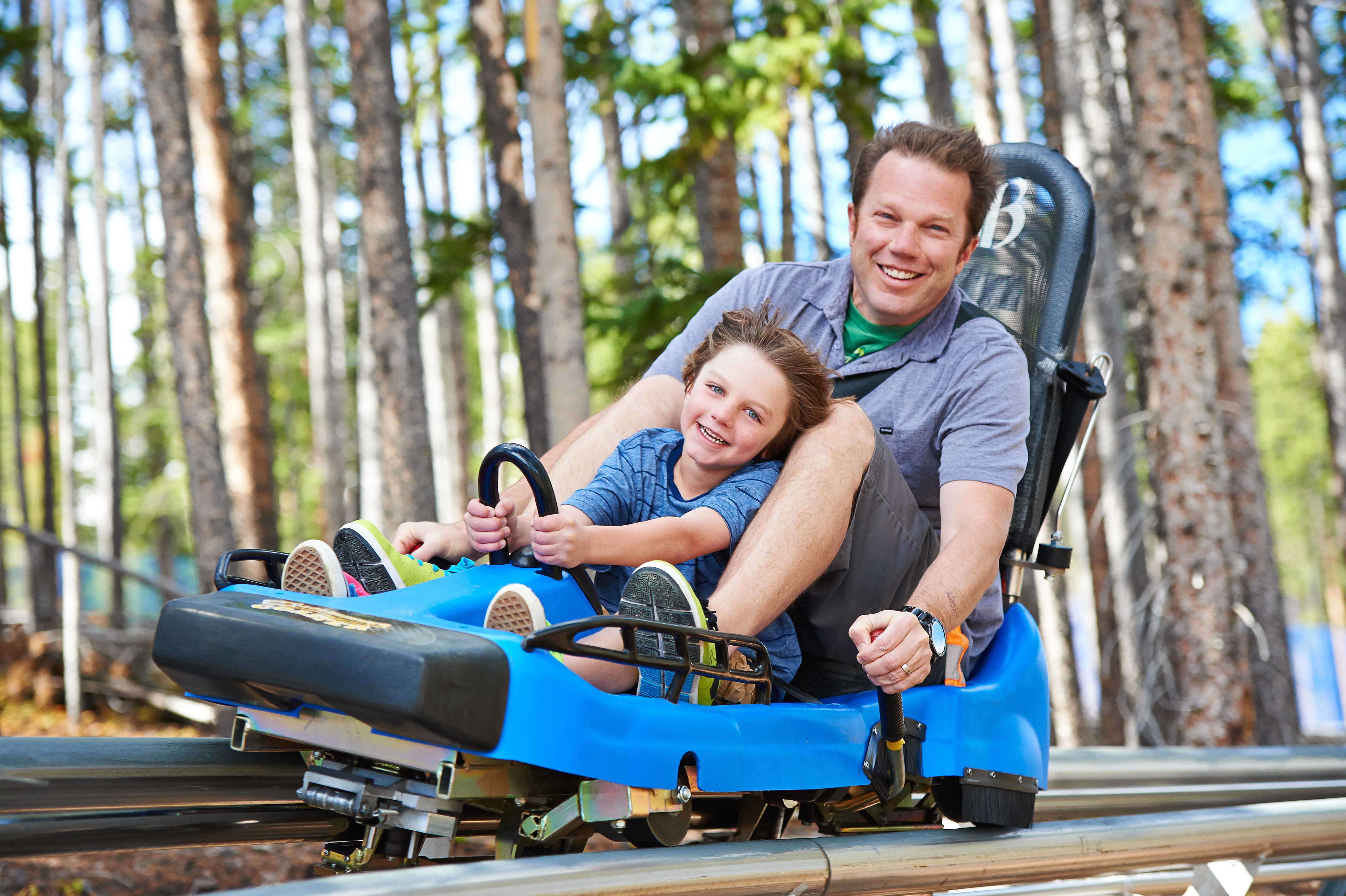 VailResorts_BRK6656_Jack_Affleck_HighRes A father and son rocket down the mountain coaster at Breckenridge Epic Discovery