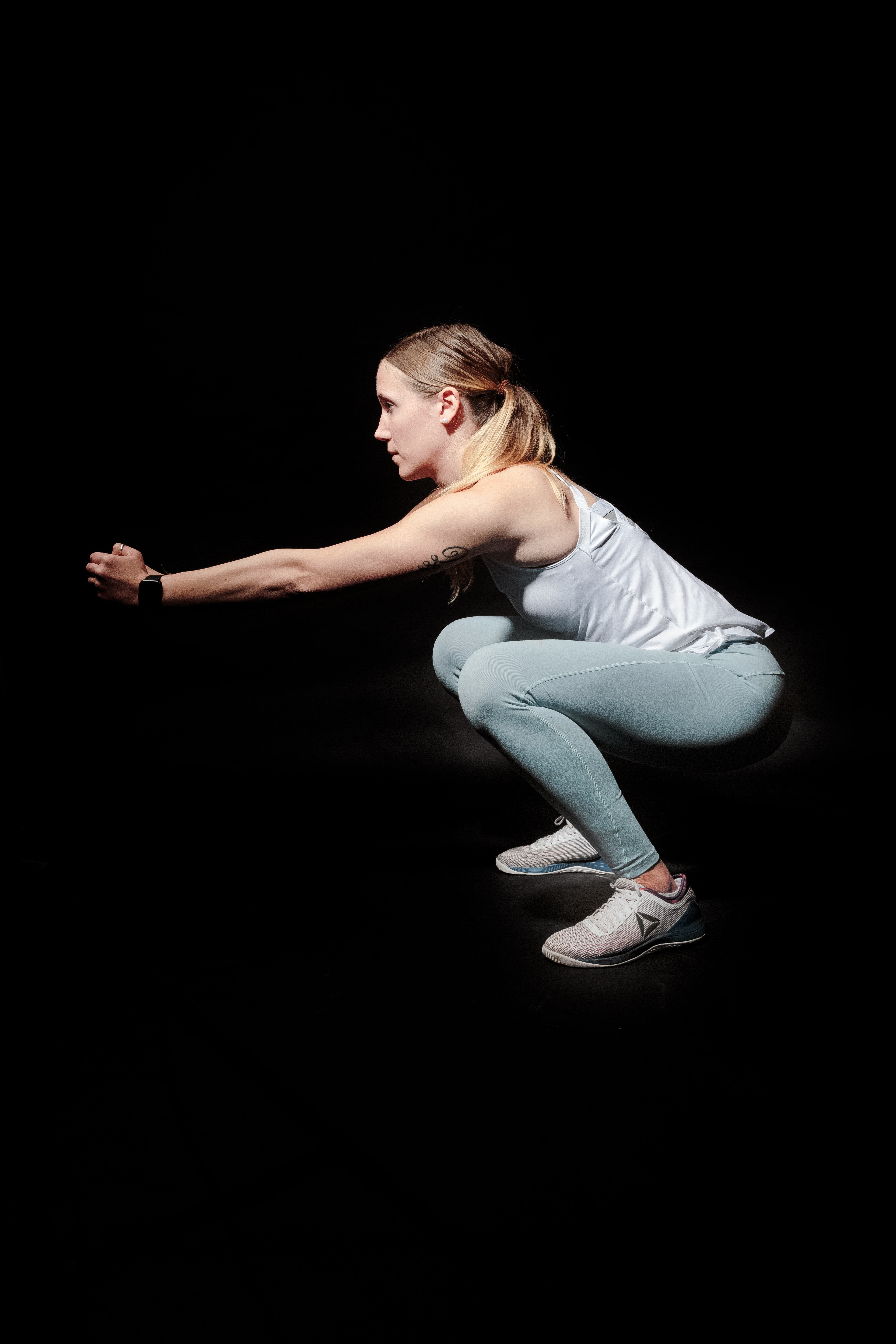 active-activewear-activity-2417485 The squat: one of the best leg strengthening moves you can add to your ski fitness routine.