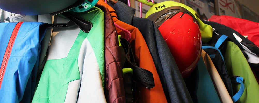 SKI Used and Abused tout Outerwear on a clothes rack