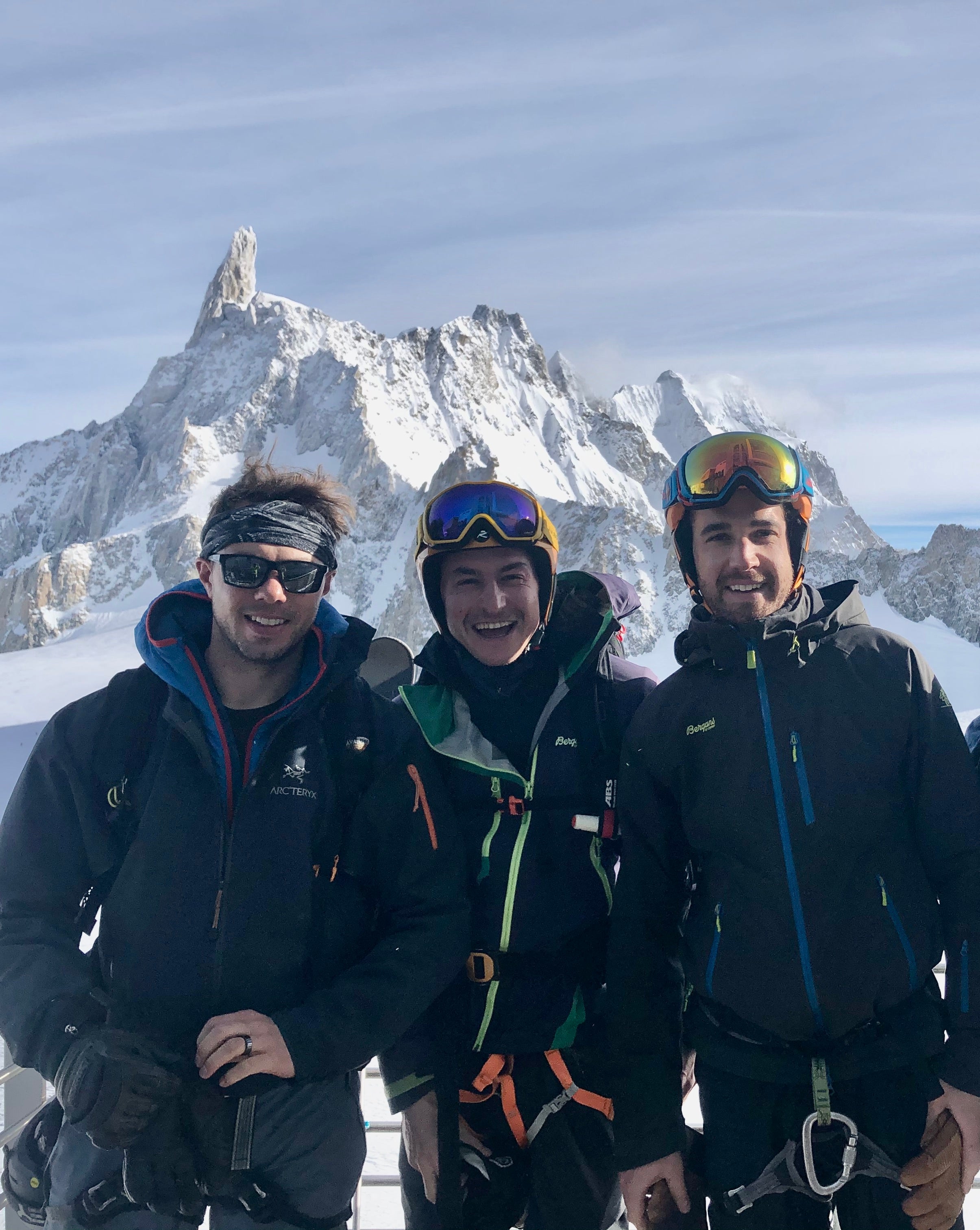 NEW 4FRNT OWNERS Charlie, Ebi, Will in Italy at the top of the Skyway Monte Bianco with Monte Bianco the background before skiing the Valley Noir. New owners of 4frnt in Chamonix