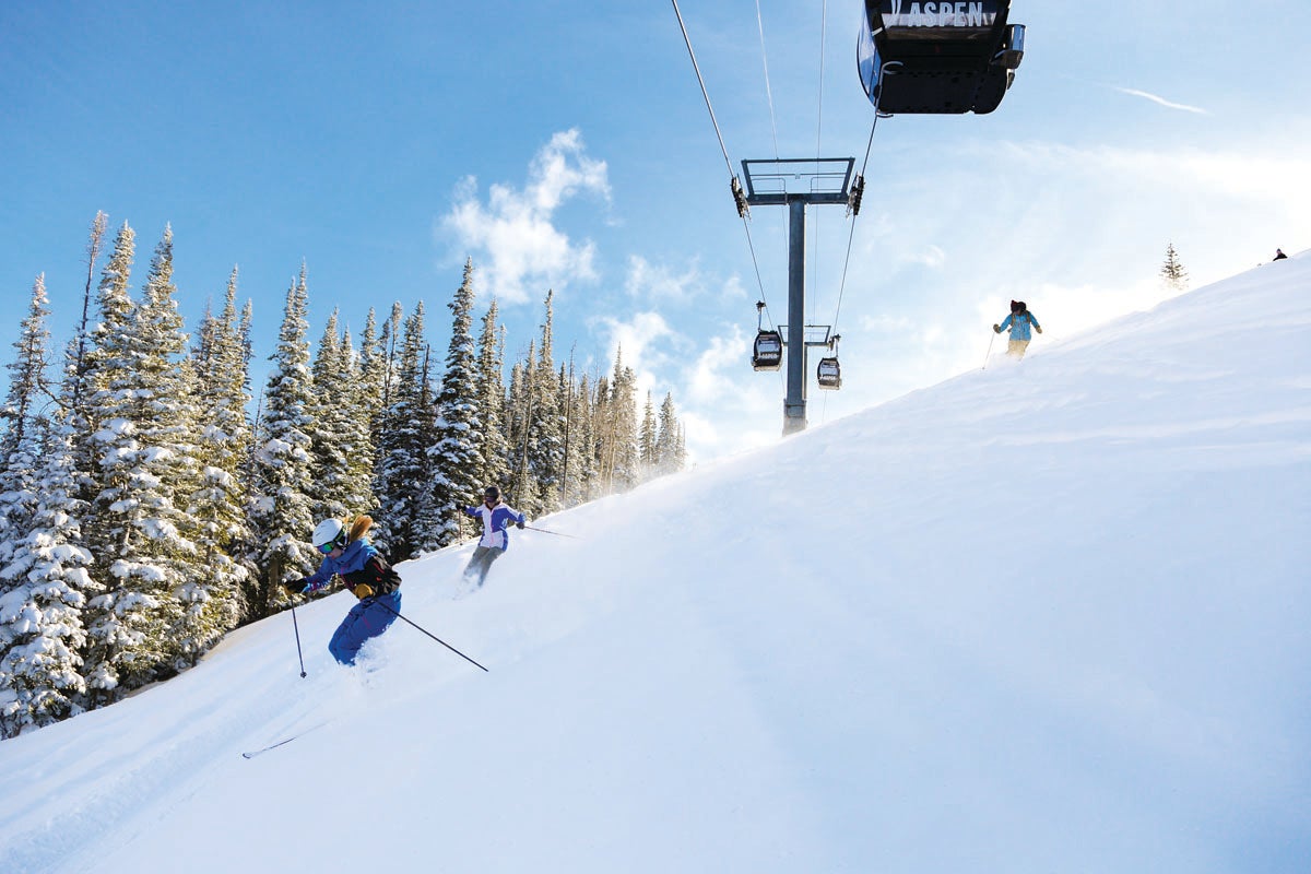 SKI1116_Aspen_Gay_Ski_Week04 Skiers under the Aspen Silver Queen Gondola