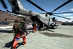 Warren Miller Storm Pic E Skiers board a US Marine CH-53 Helicopter during the filming of Warren Miller's Storm. Photo by Greg Von Doersten.