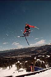 Warren Miller's <I>Storm</I> World Cup moguls champion Jeremy Bloom grabs some air during the filming of Warren Miller's Storm. Photo by Mark Weaver.