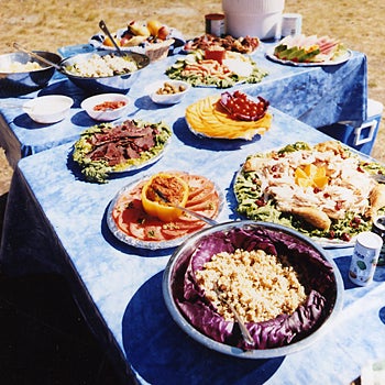 Picnic MOUNTAINS OF PLENTY Bountiful picnics are a welcome treat for riders famished from their morning exertions.