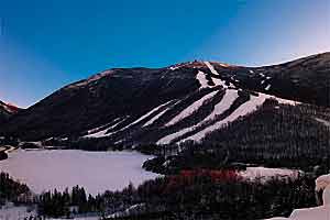 Weekend at Cannon D 1100 The fearsome Front Five, visible from the highway, plunge into Echo Lake. Cannon's moderate terrain is hidden on the other side.