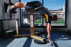 Werners A Lie prone on a back extension machine. The front edge should align with your hips and be high enough that you can bend forward at the hip joint,…