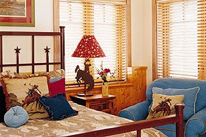 Mountain Life 1204 WESTERN CHIC The Montana theme provides a relaxing backdrop throughout the house. Dave Cecich kicks back in the living room, whose focal point is an…