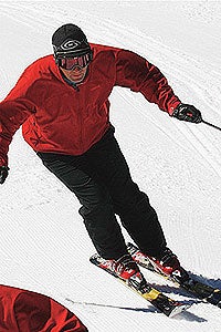 Bad Heel Cup A: This turn would have looked great 40 years ago, when every skier had to lever forward on his tips. Here, however, Mike seems to lunge forward…