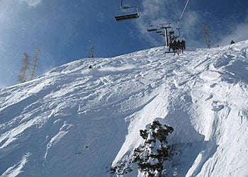 Squaw Valley USA, CA Flying over The Fingers on KT-22 with more than five feet fresh in the last week. Photo Courtesy of Squaw Valley