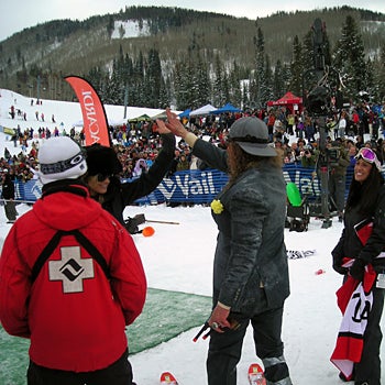 Props From the Girls A well-known competitor who is familiar to Vail's pond skimming event gets a high-five from a Bacardi Girl after successfully crossing the pond on…