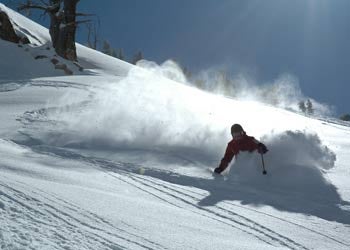 untitled image 943 Chelsea Morgan, a long-time veteran of backcountry skiing, rips through the powder with Capitol Peak in the background. Main Article