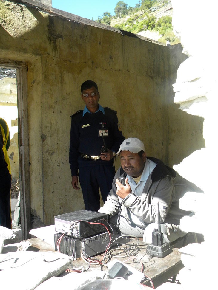 Sudden Landing With the district army general watching over his shoulder, Bajhang's air traffic controller barks orders to the pilot landing our fixed-wing plane.
