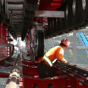 Working on the Docking Station A worker in Whistler's terminal. To create the concrete footings, lift platforms, masts and columns 4,000 cubic metres of concrete had to be trucked…