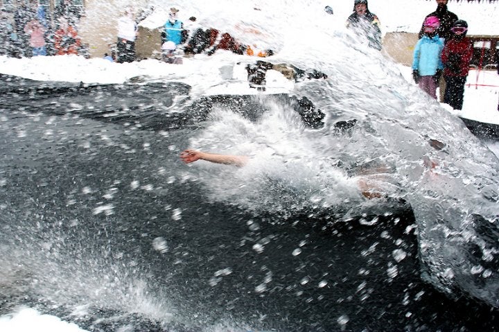 Spring Skiing by Brent Clark A Lookout Pass Ski Resort slush cupper reaches for something - anything - to get him out of the frigid water.