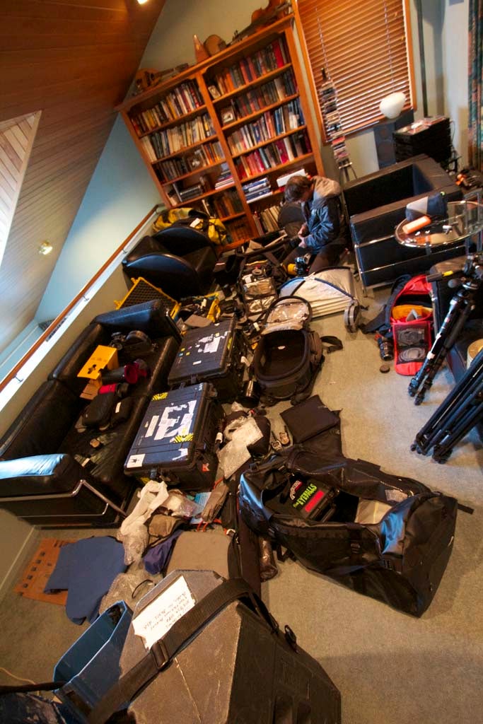 Sorting Equipment Tom Day sorts through cameras, lenses, microphones, and tripods before the shoot.