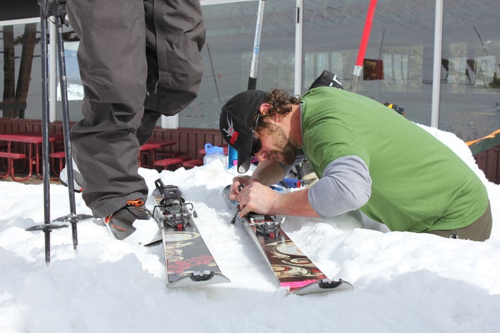 Ski Tech Justin Hewitt adjusting Dynafit bindings on Dynafit Manaslu skis None