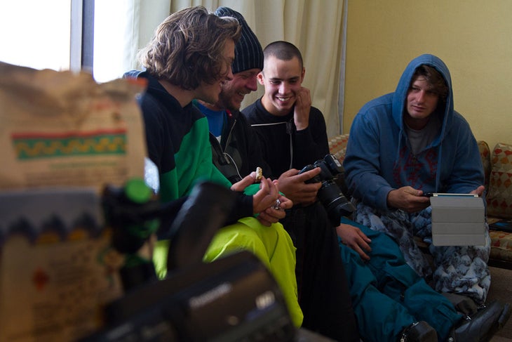 Team Klint members (L-R Will Hibbs, Christopher Lisle, Brian Kish, Ben Grunow) review their photos from day one of the Eye of the Condor in La Parva, Chile. None