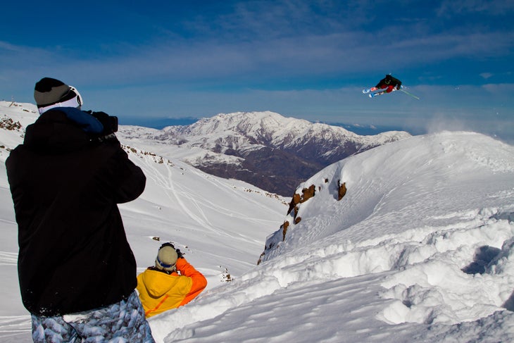 Team KLINT's Tanner Rainville throws down on day three of the Eye of the Condor in La Parva, Chile. At left, behind the cameras, are teammates Ben Grunow and Christopher Lisle. None