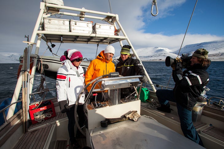 Aboard the Arctica II Warren Miller cinematographer Tom Day, right, films HH athletes Jackie Paaso, left, Aurelien Ducroz, middle, and guide Doug Stoup as the Arctica II…