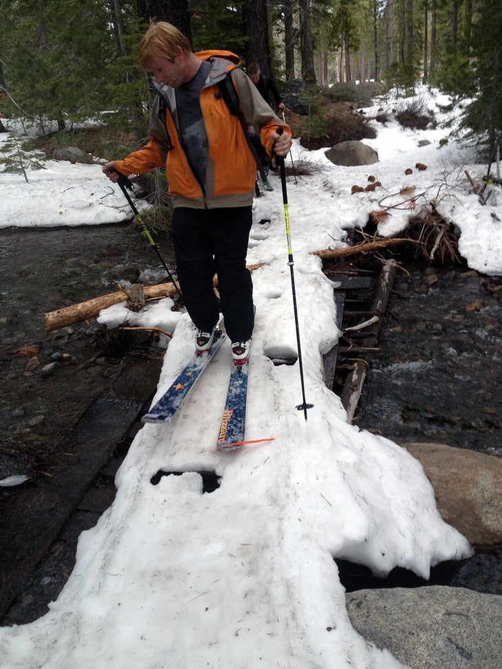 Cutts Ford Joe Cutts crosses a stream during the skin in to Lost Trail Lodge.
