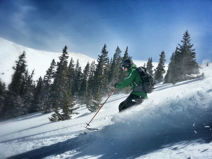 Bluebird Powder With fresh snow and bluebird skies, conditions could not have better. Stephen Sebestyen smears a turn through Independence Bowl. Photo: Dustin…