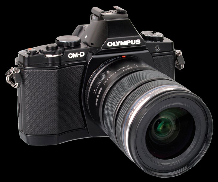 Olympus OM-D E-M5 camera If your DSLR and an iPhone have a baby, you've got one awesome mutt. The E-M5 body plus three lenses is about equal to the weight of my professional…