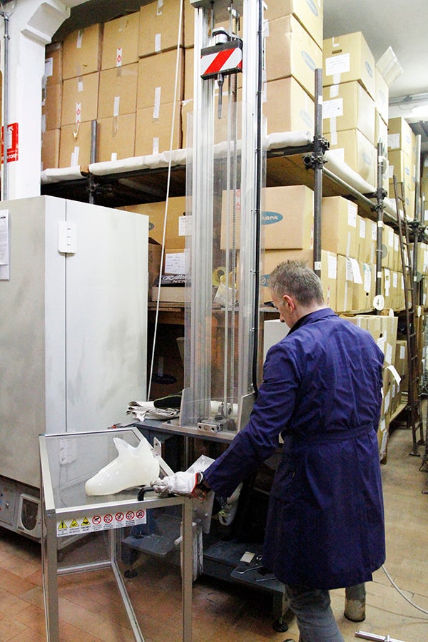 Quality Control Completed boots and many critical components are continuously tested for durability. Here, a boot technician tests the strength of a boot’s walk mode…