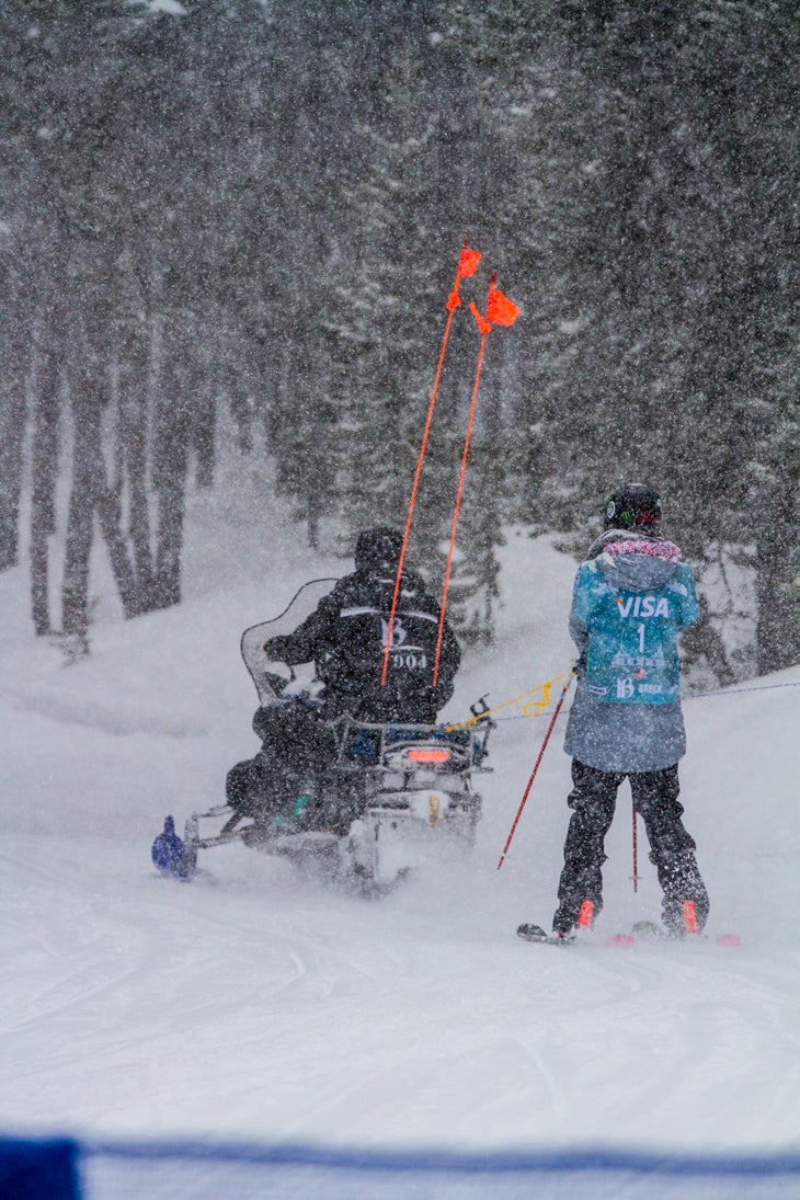 Getting a Lift Brita Sigourney (U.S.) takes a snowmobile tow after practice to the top of the halfpipe for the start of her first run. The Breckenridge park crew…
