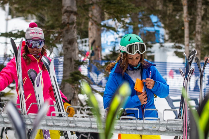 Ski Test 2014: Day 1 Kristi Brown and Georgie Bremner get ready for another lap at the base of GadZoom. Get more behind the scenes here.