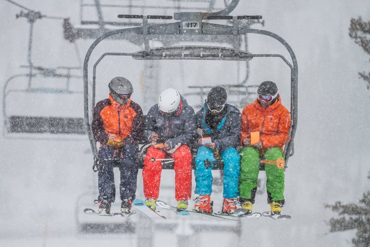 Ski Test 2014: Day 2 Testers (from left to right) Jeremy Benson, Kevin Luby, Scott Basso, and Mark Elling take time to hash out ski test cards while riding the lift.