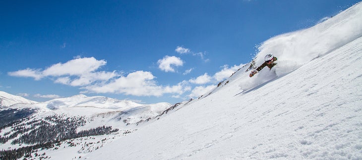 Blue Sky and Deep Snow Tester Katie Peterson rips through deep snow at Loveland.