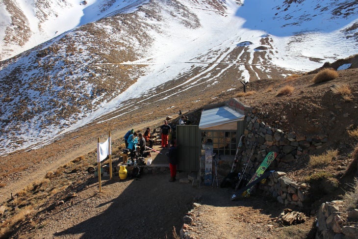 Base Lodge Forget cushy lodges. Here, the hut serves the essentials, like Nescafe and cheap Chilean beer to drink while checking beacons and celebrating…