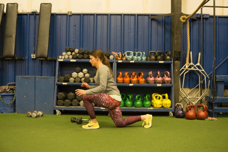 "Tess Wood performs unweighted jump lunge"