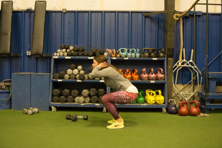 "Tess Wood performs jump squats"