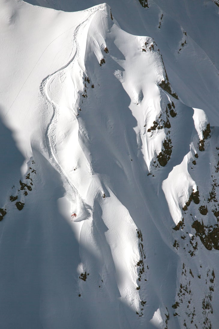 SKI0218_CHI14_byEricSales Taking full advantage of her heli drop off, pro skier LynseyDyer gets after it on the steeps of Valle Nevado.
