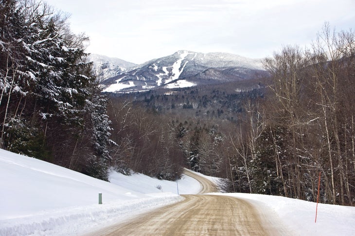 SKI0218_Suds_Stowe3_istockCapecodphoto A view of Stowe from an iconic Vermont country road