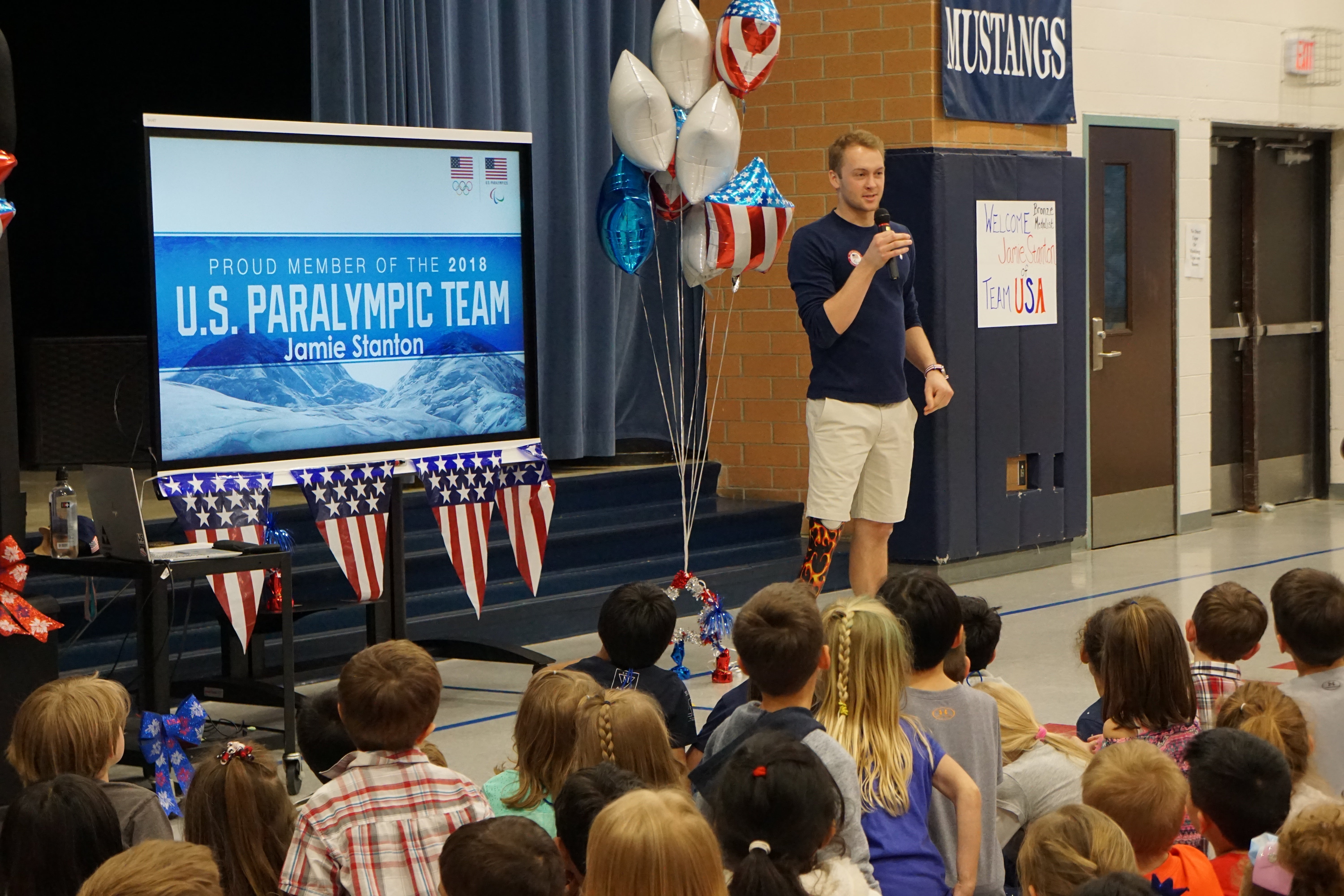 "Jamie Stanton gives a presentation at his old elementary school."