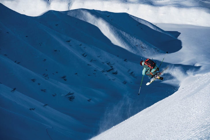 SKI1218-Tordrillo07-byCamMcLeod_S Jillson takes to the air on the runout to the heli pickup zone.