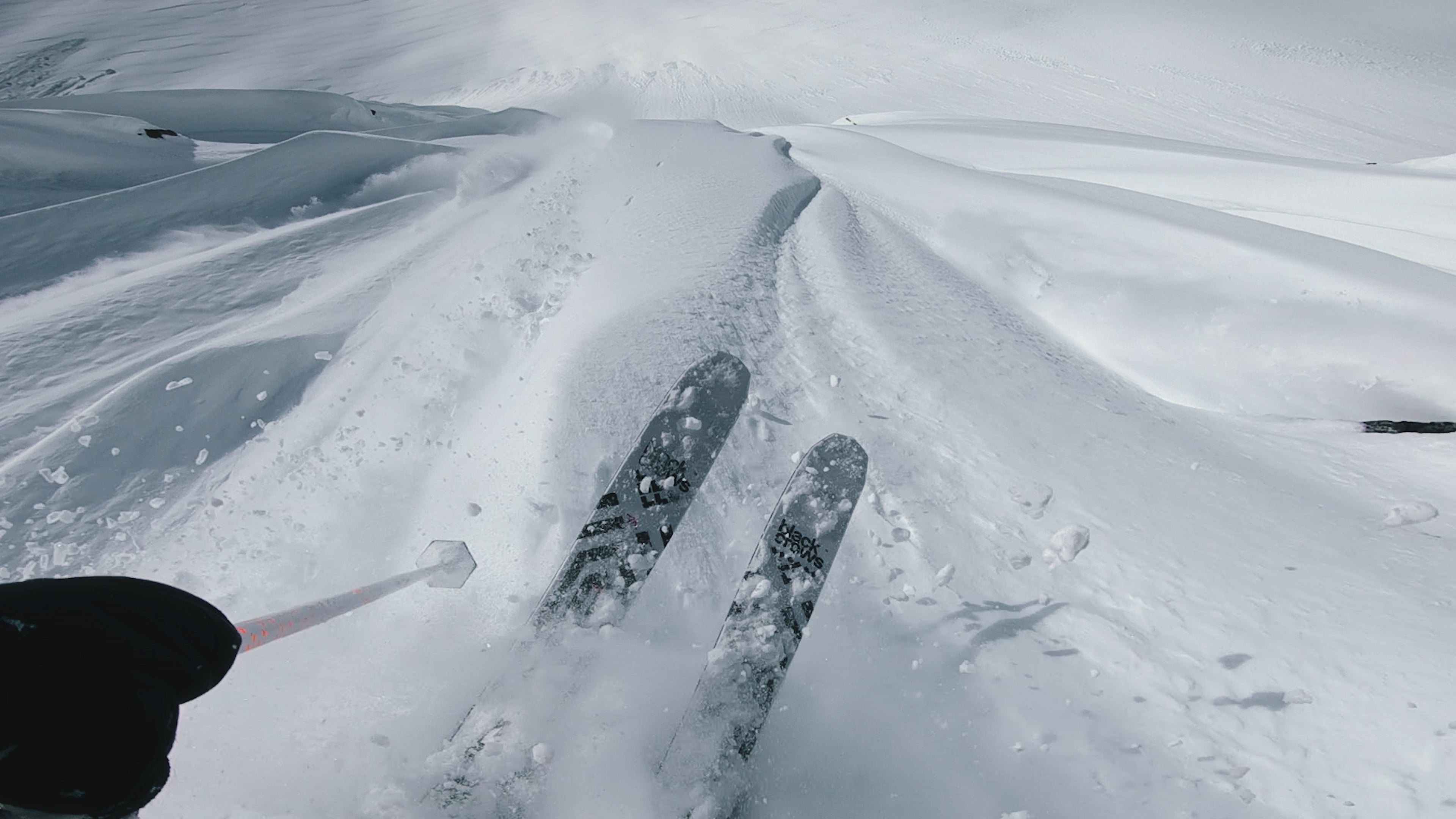 "Michelle Parkers skis above a steep ski slope"
