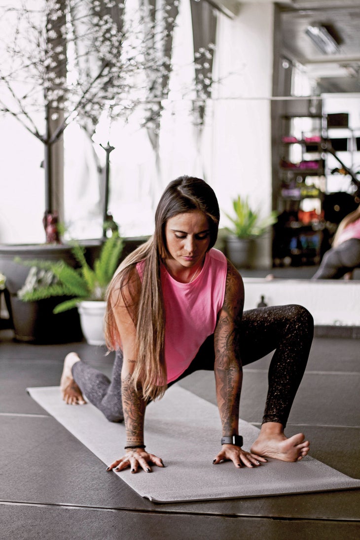 SKI1219-FIT-LizardLunge copy Ashley Battersby performing lizard lunge yoga pose