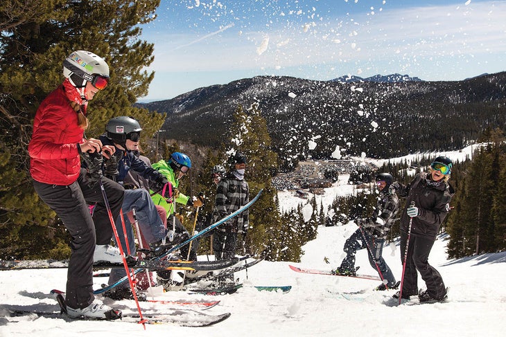 SKI0120-Eldora06 Freestyle coaches Lex Bennet and Vitek Linhart enjoy a snow shower courtesy of their young athletes.