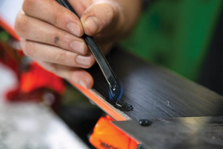 SKI0120-Tuning3-BaseRepair How to repair ski base damage. Step 3: Melt P-Tex over damaged area.